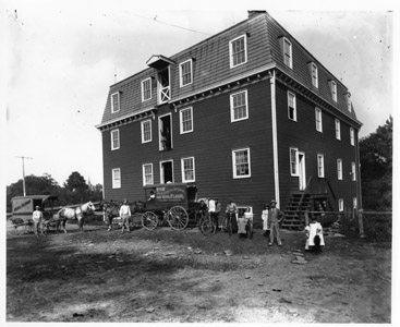 This 1900 photograph shows the Kingston Flour Mill, which produced the Golden Wing and Seal brands of flour.  The present mill structure was built in 1888 and was in operation through the 1940s under the ownership of Matthew Suydam, Jr.  Today the mill is a private residence and a picturesque reminder of the historic and economic development of the community.  In 1986, the Kingston Mill Historic District was added to the State and Federal Registers of Historic Places.  